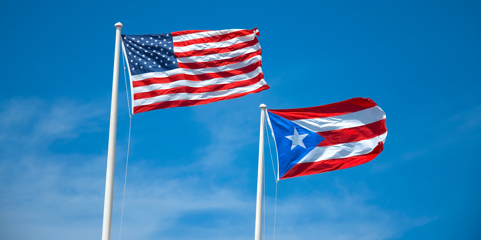 red and white striped flag with blue triangle